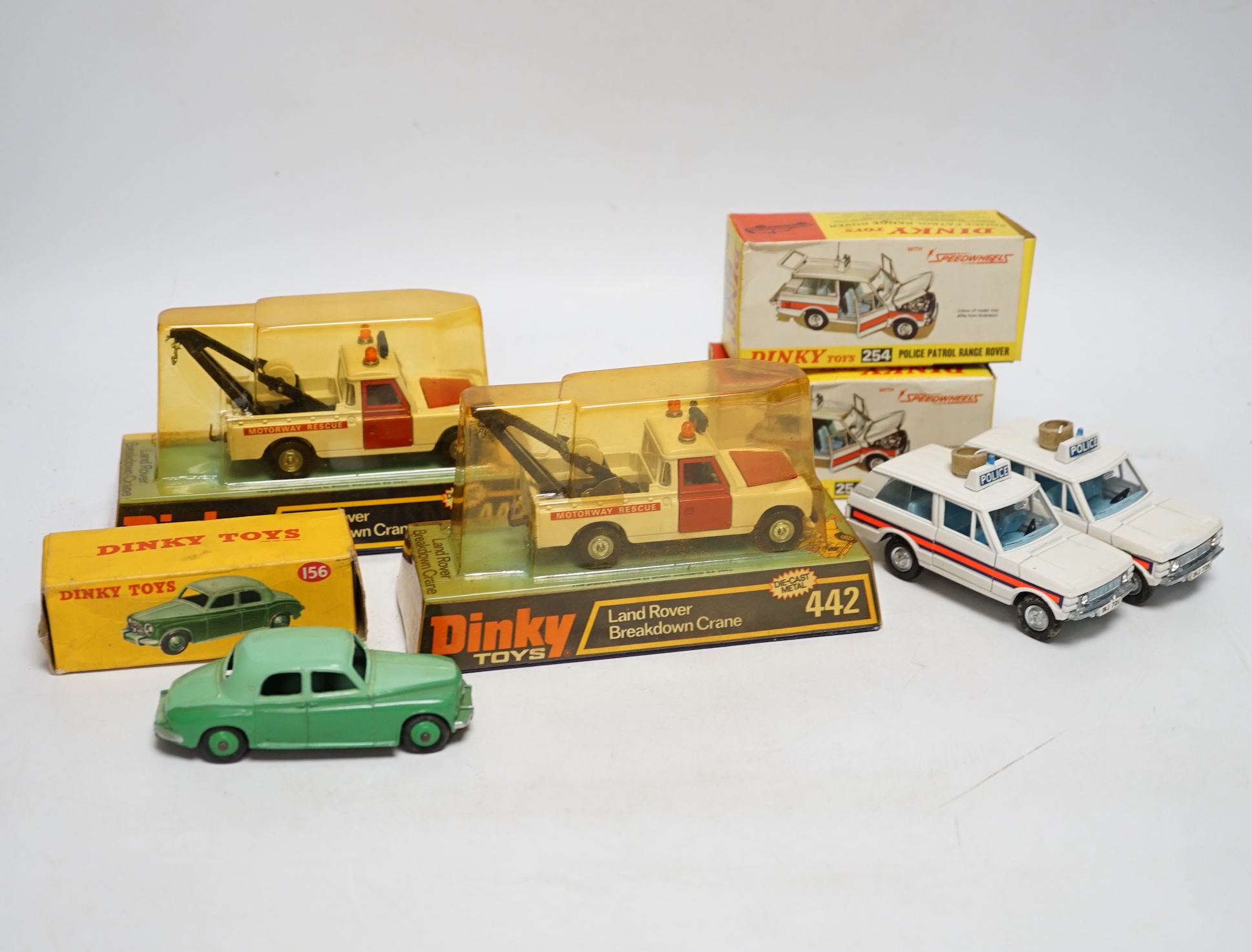 Five boxed Dinky Toys; Rover 75 Saloon (156) in correct two-tone green colour spot box, two Police Patrol Range Rover (254) and two Land Rover Breakdown Crane (442)